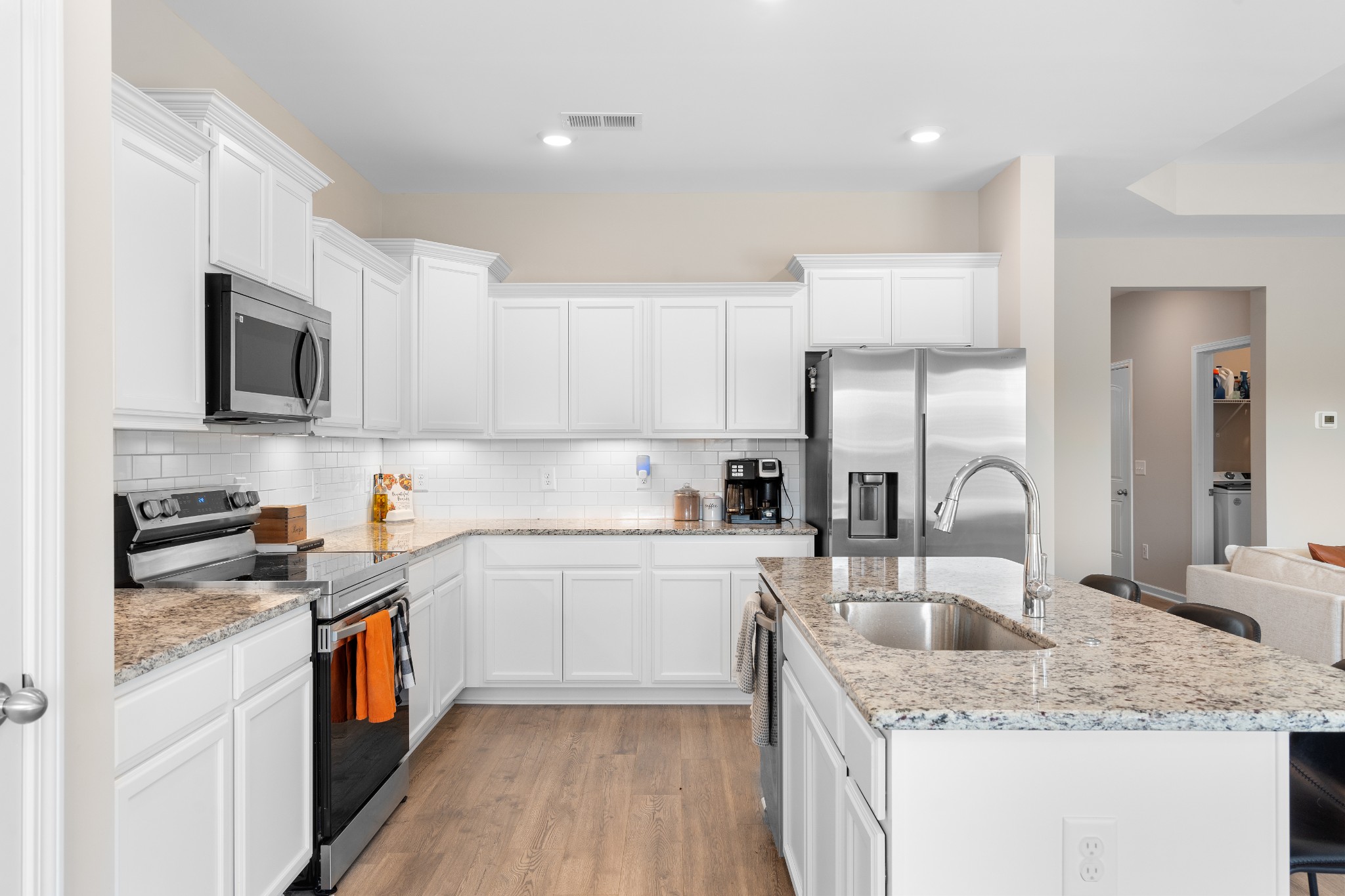 284 Thorpe Drive Spring Hill, TN 37174 - Photo 12 of 34 a kitchen with a sink stove top oven and refrigerator