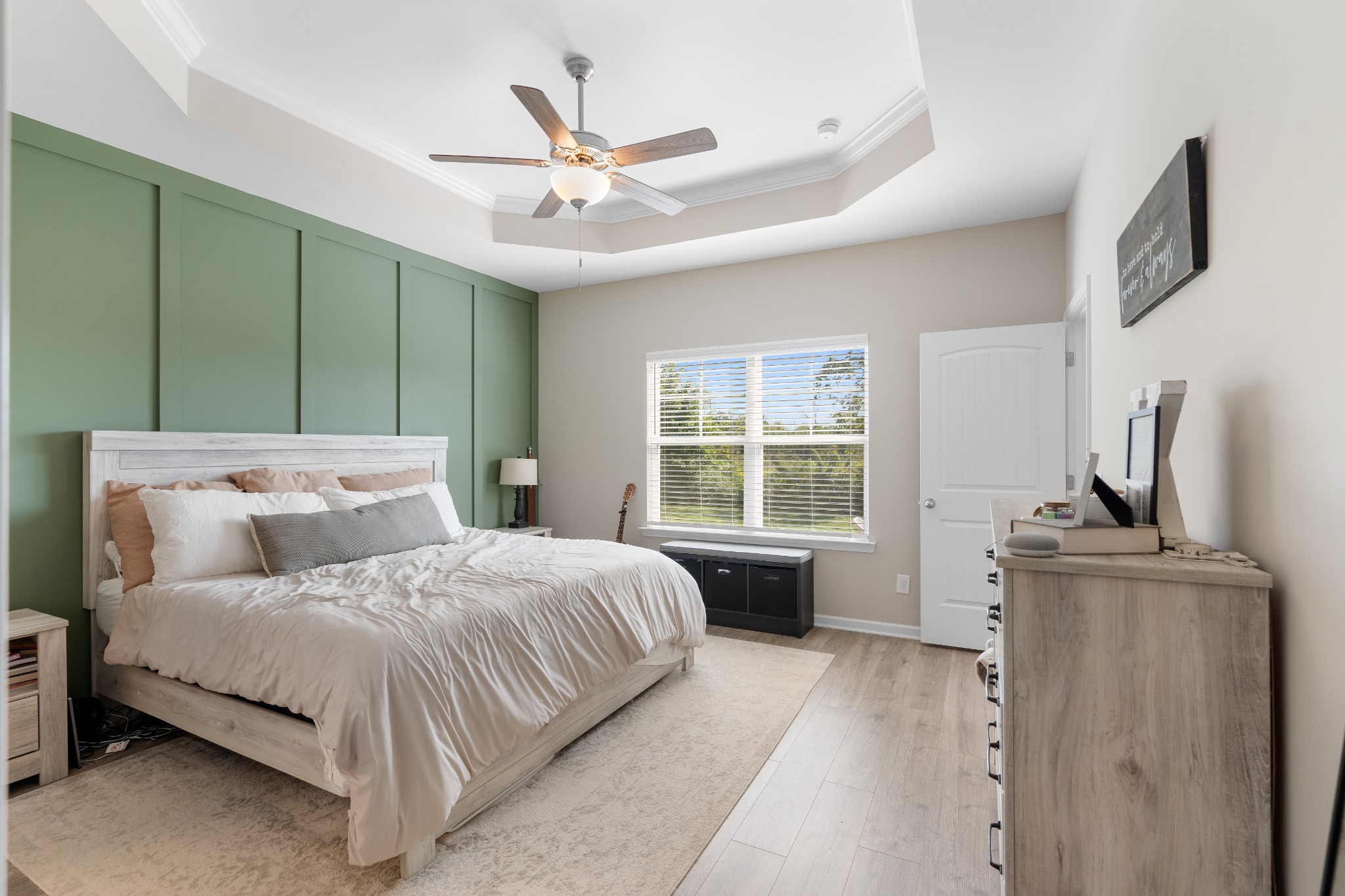 284 Thorpe Drive Spring Hill, TN 37174 - Photo 16 of 34 a bedroom with a large bed and a chandelier