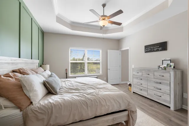 a bedroom with a large bed and a window