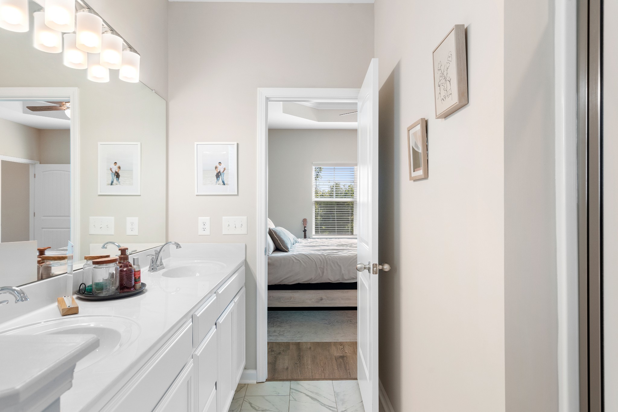 284 Thorpe Drive Spring Hill, TN 37174 - Photo 20 of 34 a en suite bathroom with a double vanity sink and a mirror