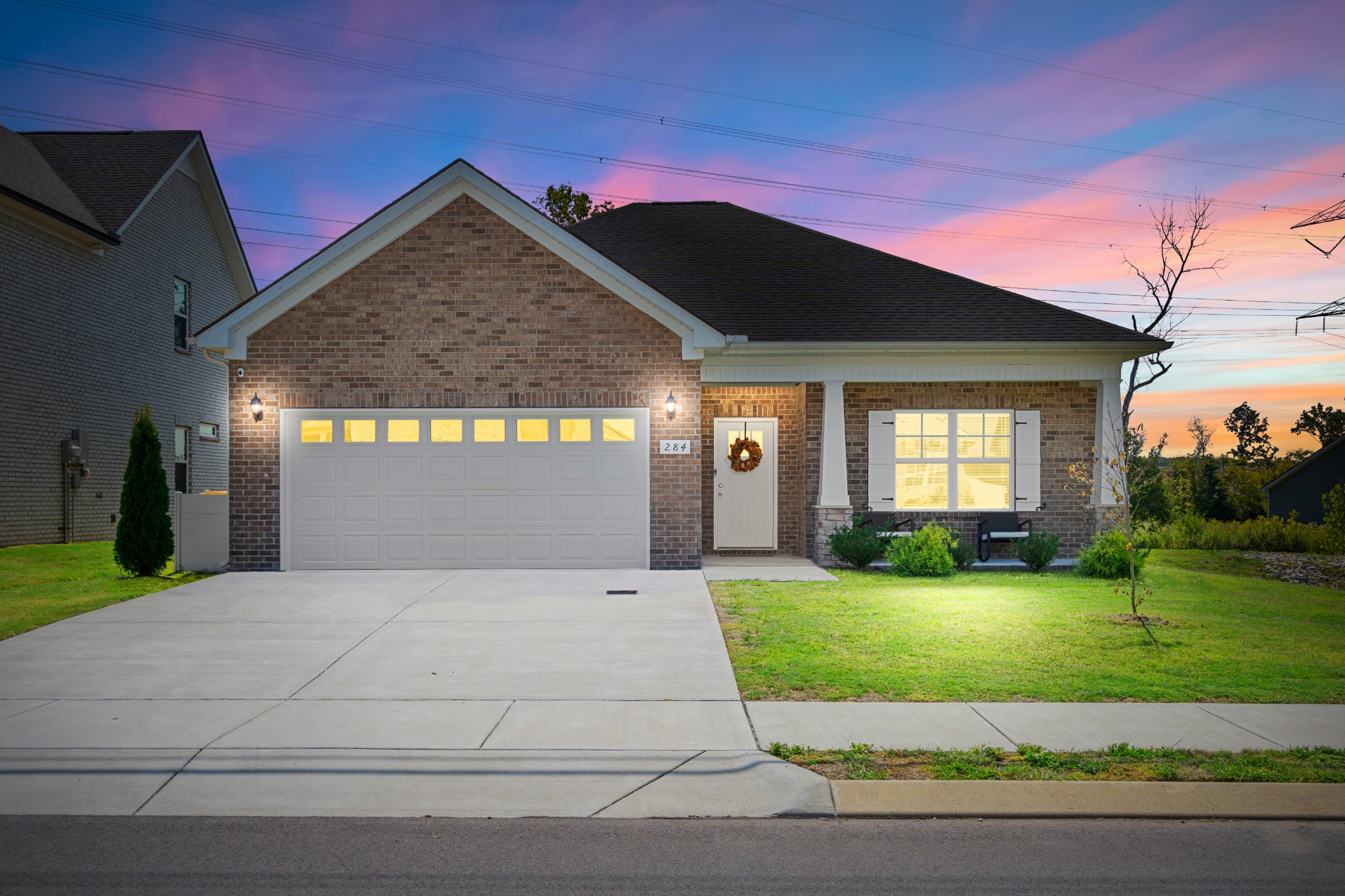 284 Thorpe Drive Spring Hill, TN 37174 - Photo 2 of 34 a front view of a house with a yard and garage