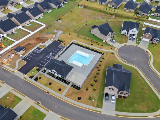 an aerial view of a house with a swimming pool