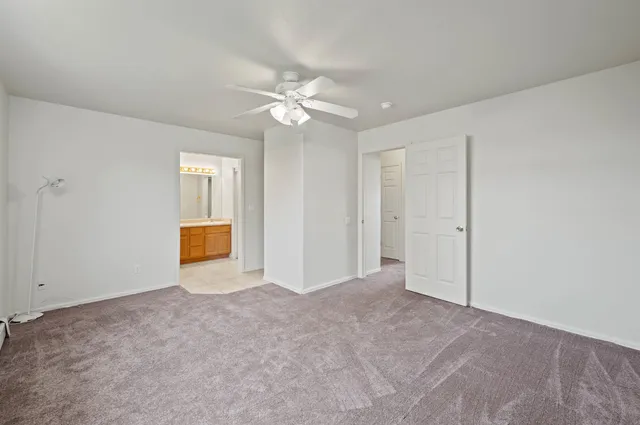 a view of an empty room with a bathroom