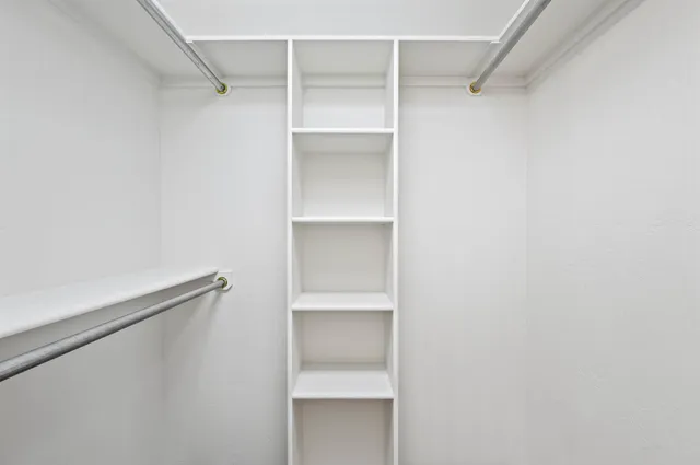 a view of an empty walk in closet