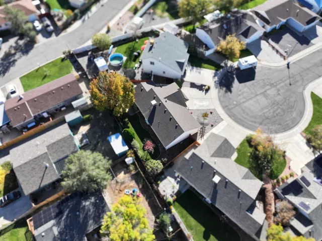 an aerial view of residential houses with outdoor space