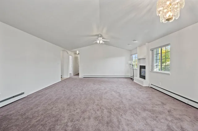 an empty room with windows and entrance