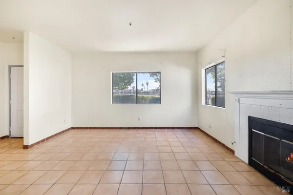 a view of an empty room with windows