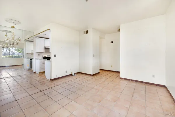 a view of a kitchen with wooden floor