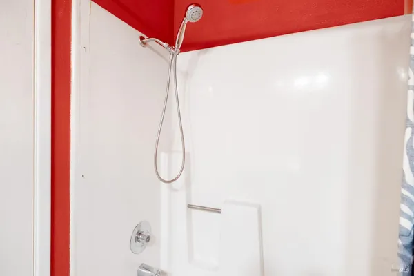 a bathroom with a glass shower door