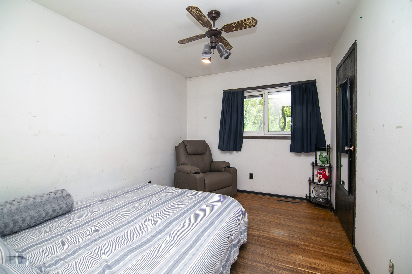 418 South 5000W Road Kankakee, IL 60901 - Photo 13 of 38 a bedroom with a bed and a chandelier
