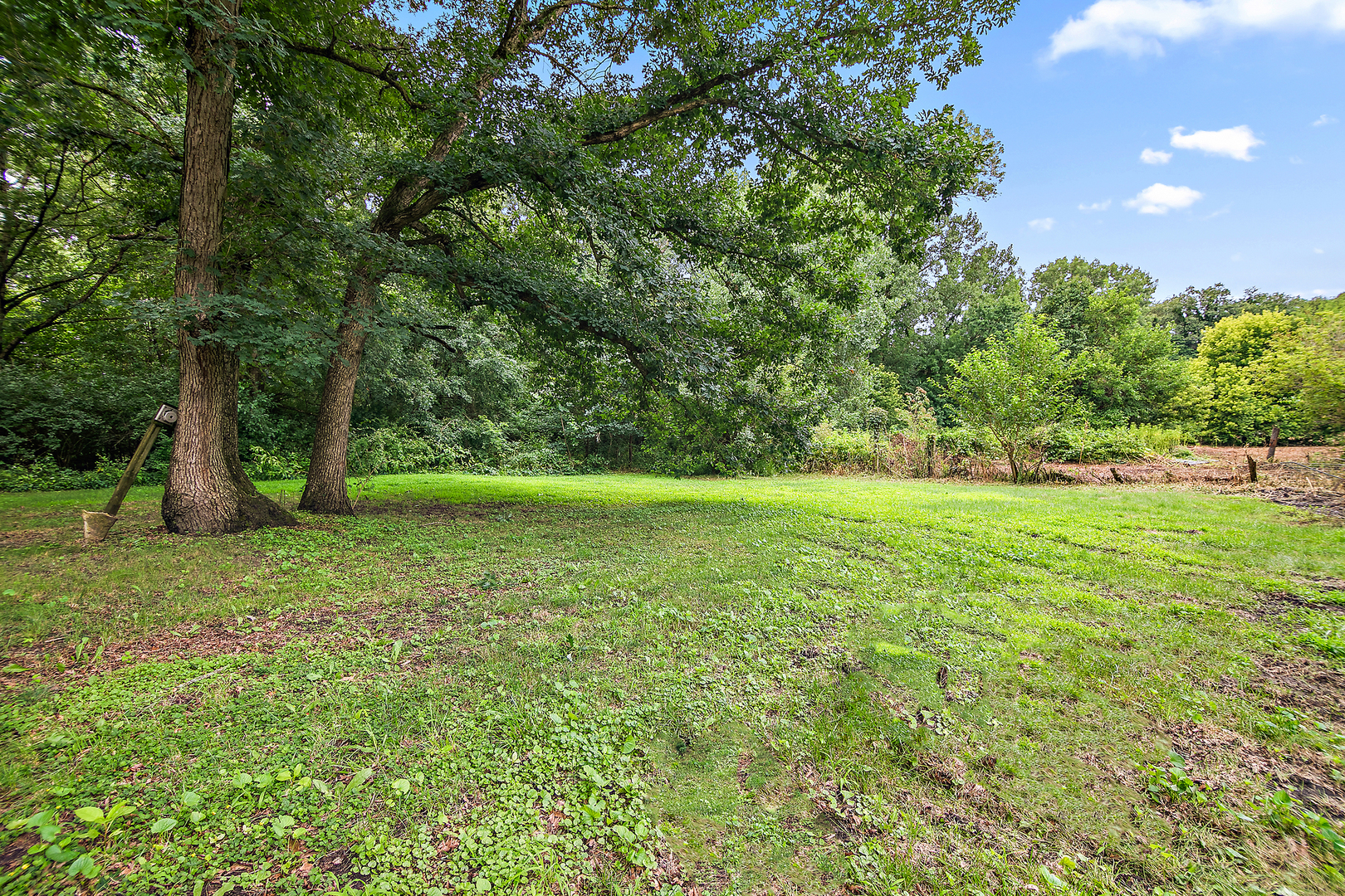 418 South 5000W Road Kankakee, IL 60901 - Photo 21 of 38 a view of outdoor space with deck and yard