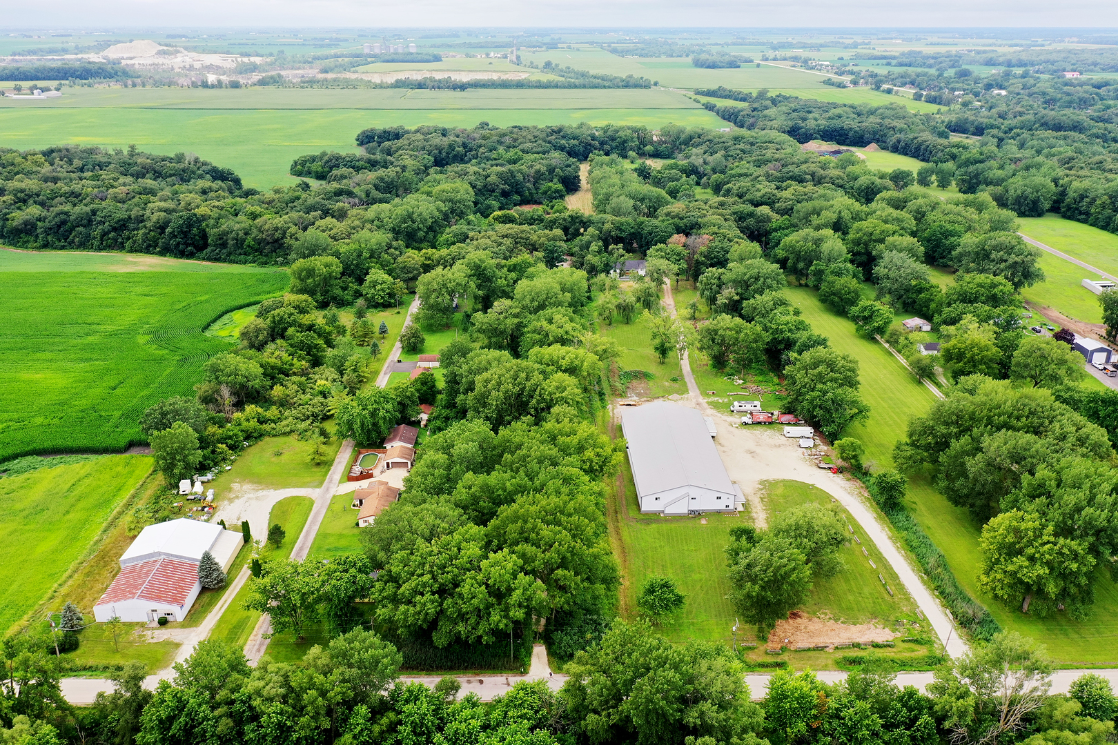 418 South 5000W Road Kankakee, IL 60901 - Photo 33 of 38 an aerial view of residential houses with outdoor space and trees