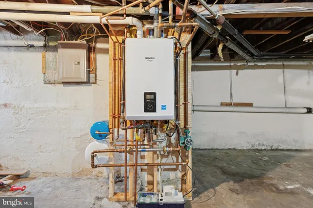 a view of a house with a big yard plants and large trees