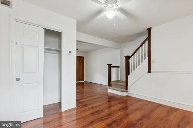 a view of an entryway with wooden floor