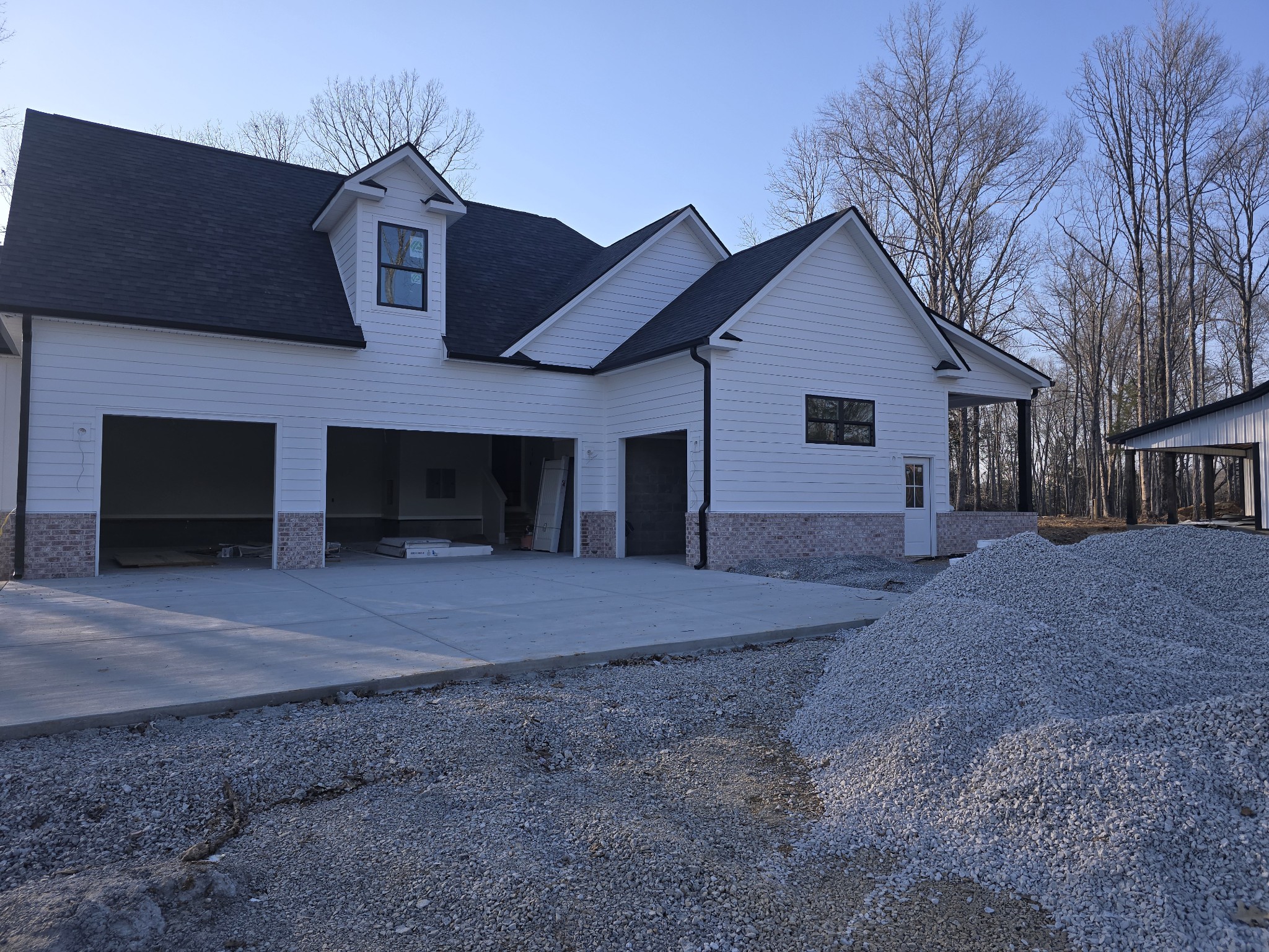 4833 Kedron Road Spring Hill, TN 37174 - Photo 3 of 6 a front view of a house with a yard and garage