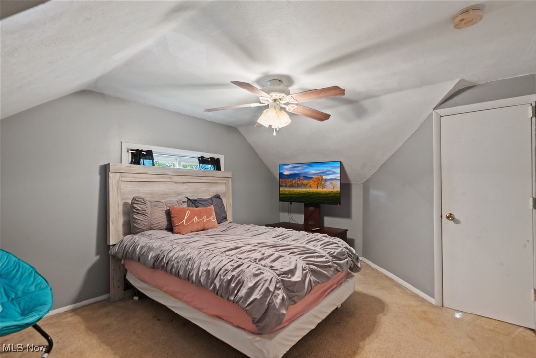 1271 Lander Road Cleveland, OH 44124 - Photo 20 of 37 Generous 3rd bedroom upstairs showcasing a lofted, angled ceiling and overhead fan for extra comfort.