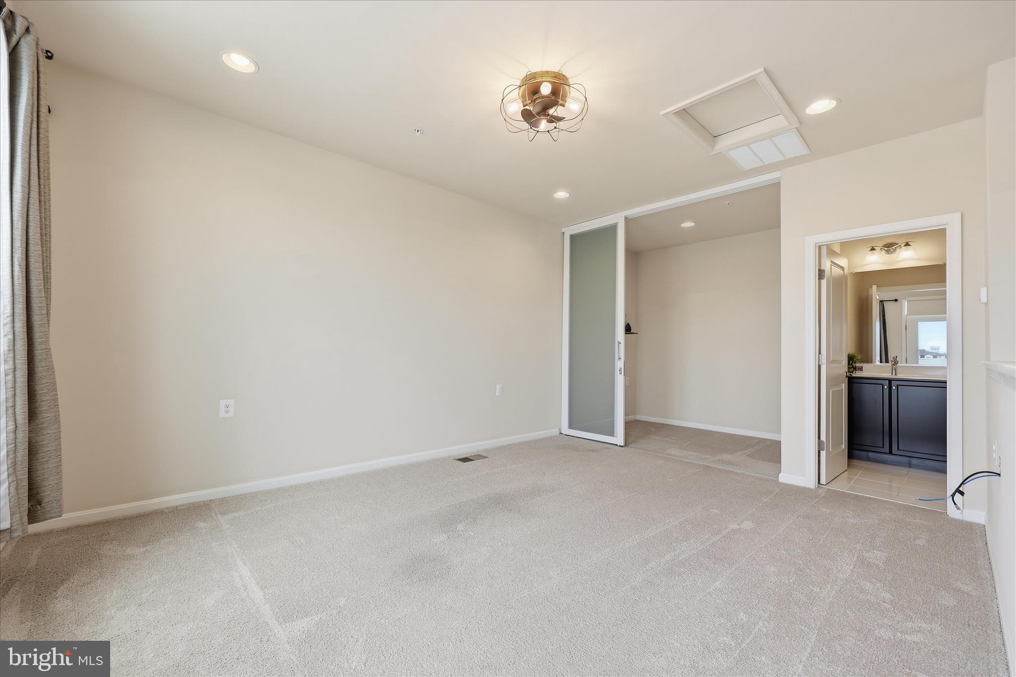 1090 Holden Road Frederick, MD 21701 - Photo 29 of 60 an empty room with closet and a chandelier fan