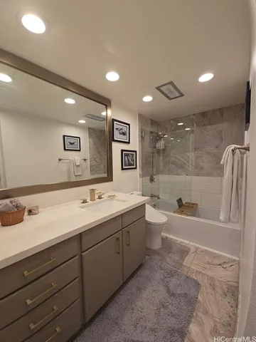 a spacious bathroom with a bathtub sink and toilet