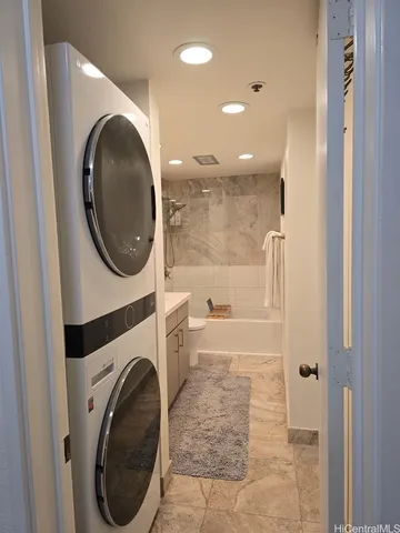 a view of a hallway with washer and dryer