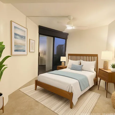 a bedroom with a bed and a painting on the wall