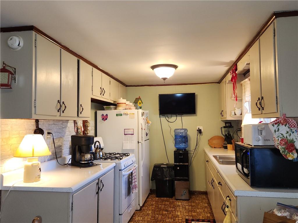 1681 Shady Plain Road Apollo, PA 15613 - Photo 24 of 25 a kitchen with a sink stove and refrigerator