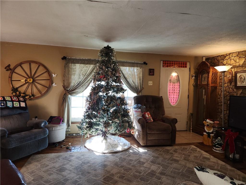 1681 Shady Plain Road Apollo, PA 15613 - Photo 5 of 25 a living room with furniture and a chandelier