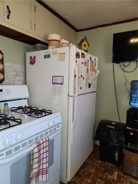 1681 Shady Plain Road Apollo, PA 15613 - Photo 10 of 25 a white refrigerator freezer sitting inside of a kitchen