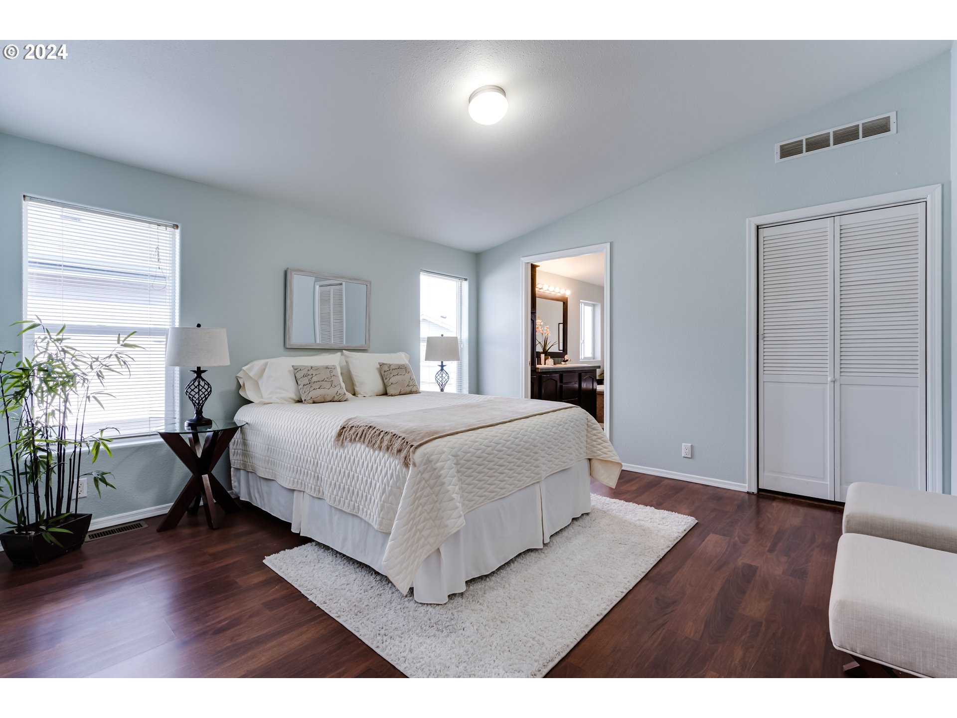2533 Maia Loop Springfield, OR 97477 - Photo 11 of 28 a spacious bedroom with a bed and a wooden floor