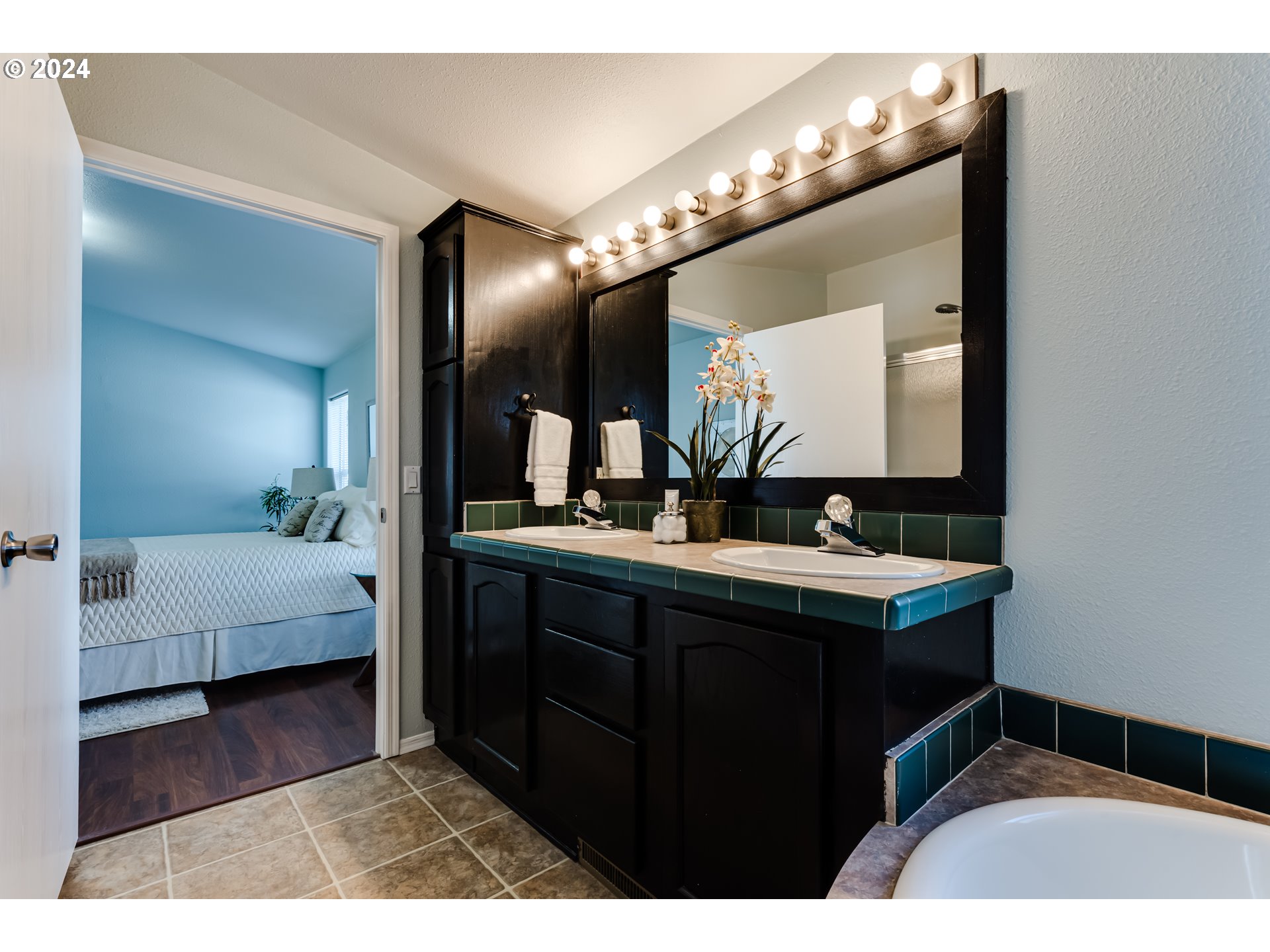 2533 Maia Loop Springfield, OR 97477 - Photo 14 of 28 a en suite bathroom with a sink double vanity and a mirror