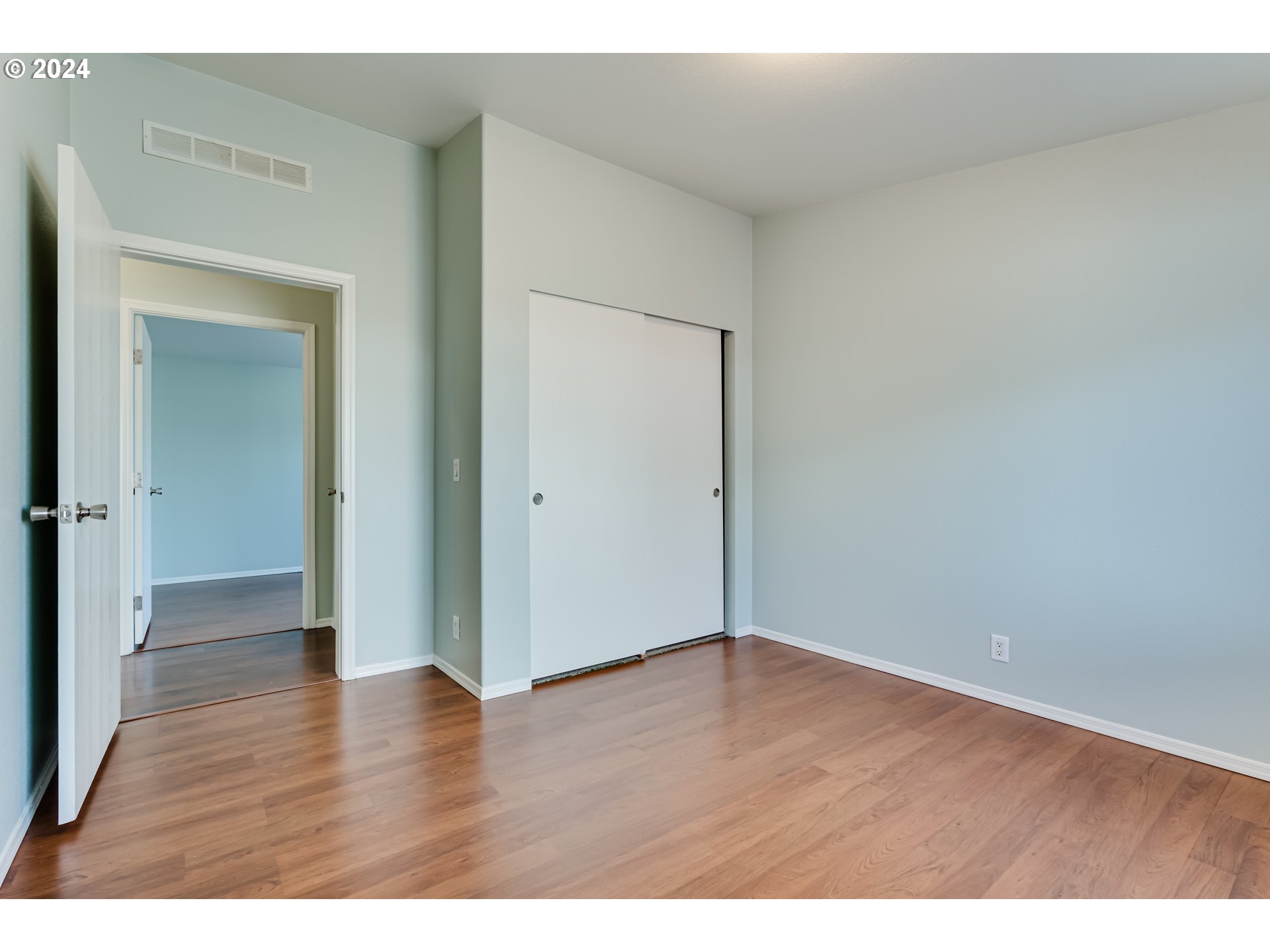 2533 Maia Loop Springfield, OR 97477 - Photo 18 of 28 a view of an empty room with wooden floor