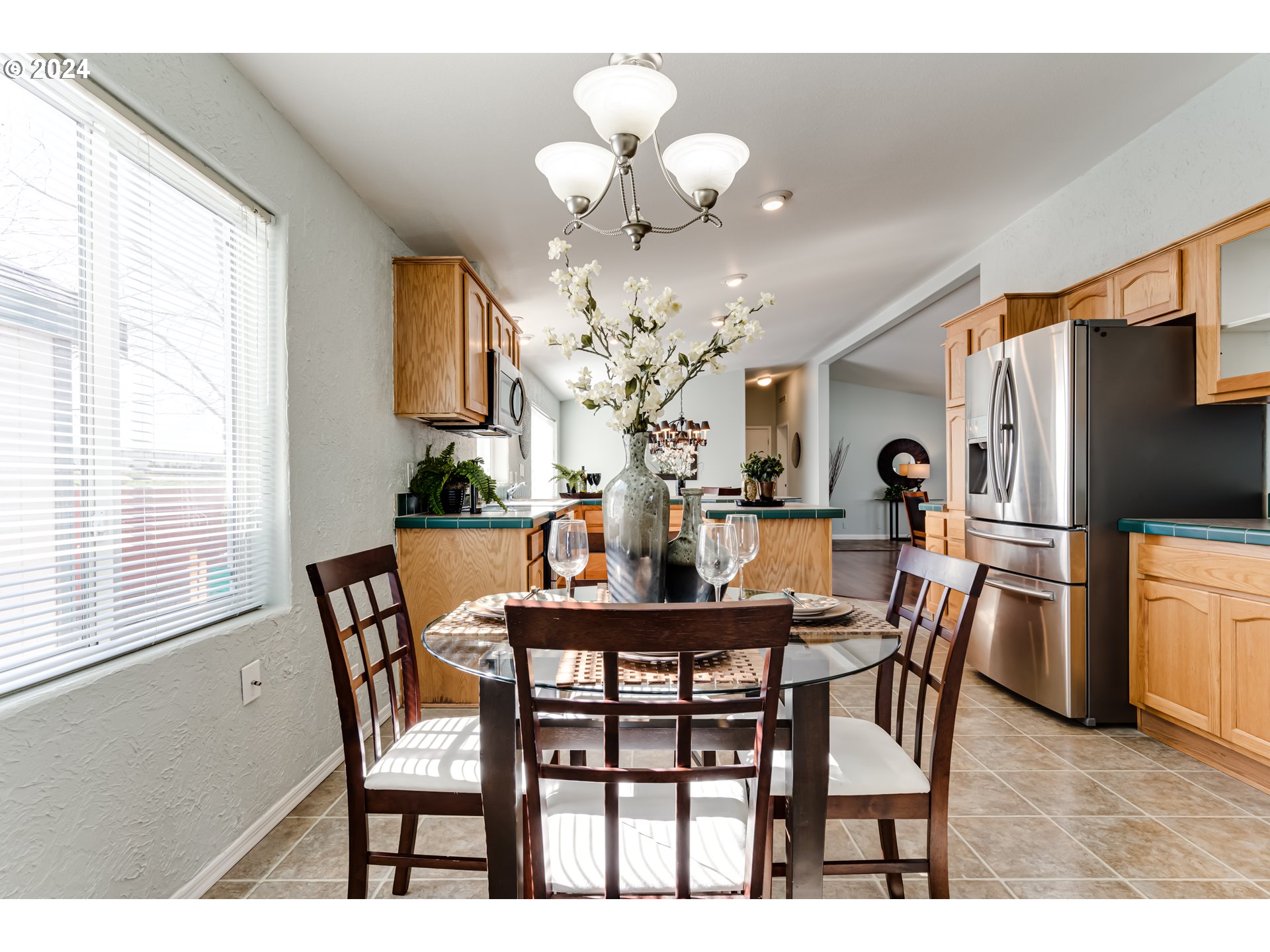 2533 Maia Loop Springfield, OR 97477 - Photo 10 of 28 a view of a dining room with furniture and chandelier