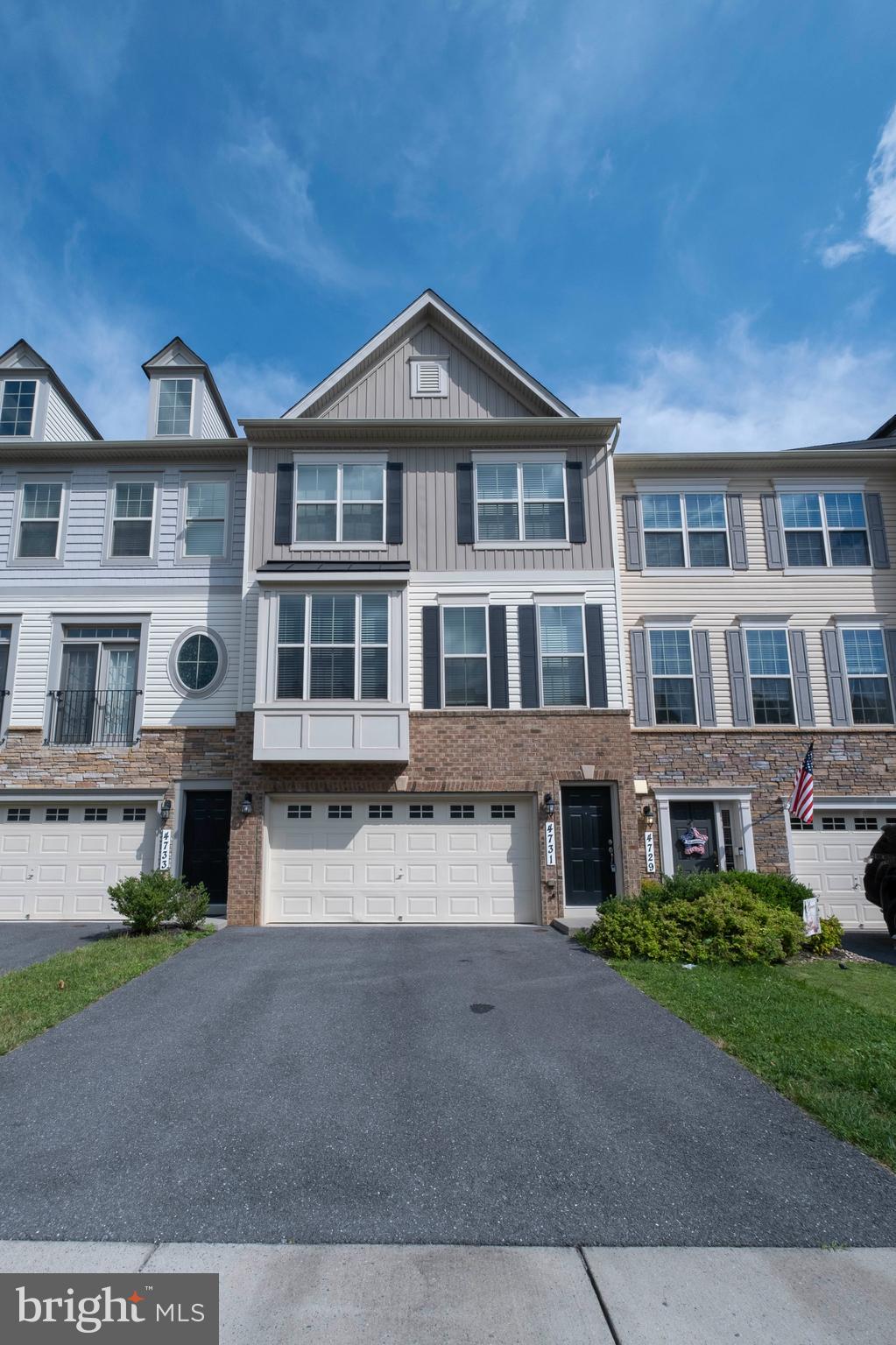 4731 Cambria Road Frederick, MD 21703 - Photo 2 of 63 a front view of a residential apartment building with a yard