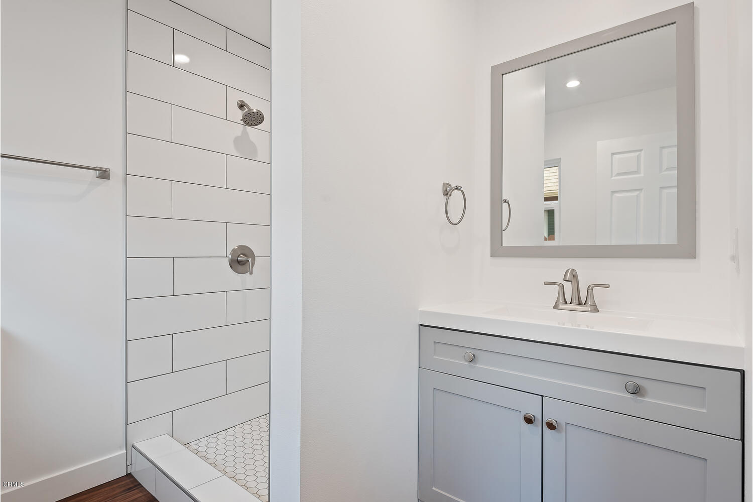 1034 West Roderick Avenue Oxnard, CA 93030 - Photo 11 of 20 a bathroom with a sink and a mirror