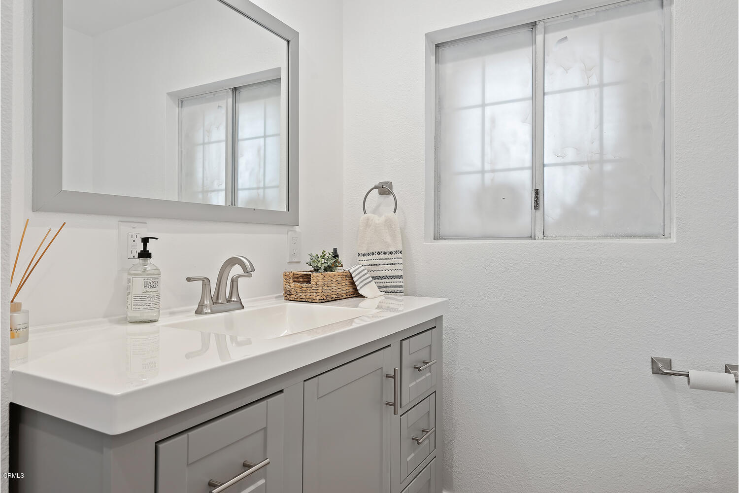 1034 West Roderick Avenue Oxnard, CA 93030 - Photo 14 of 20 a bathroom with a sink and a vanity