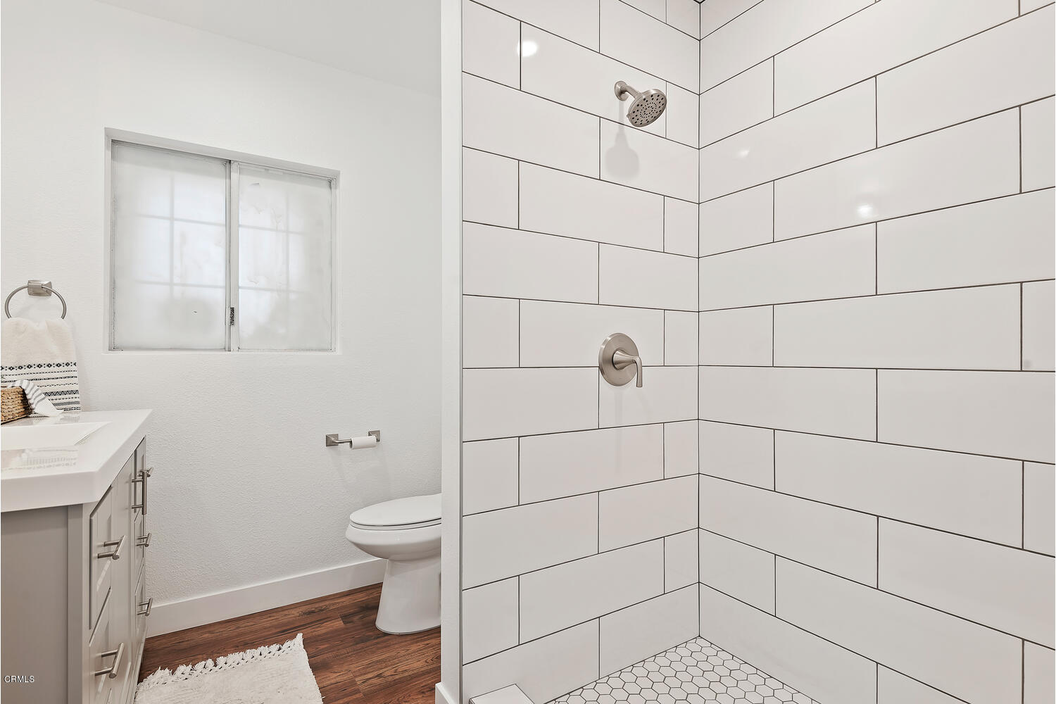 1034 West Roderick Avenue Oxnard, CA 93030 - Photo 15 of 20 a bathroom with a sink toilet and shower