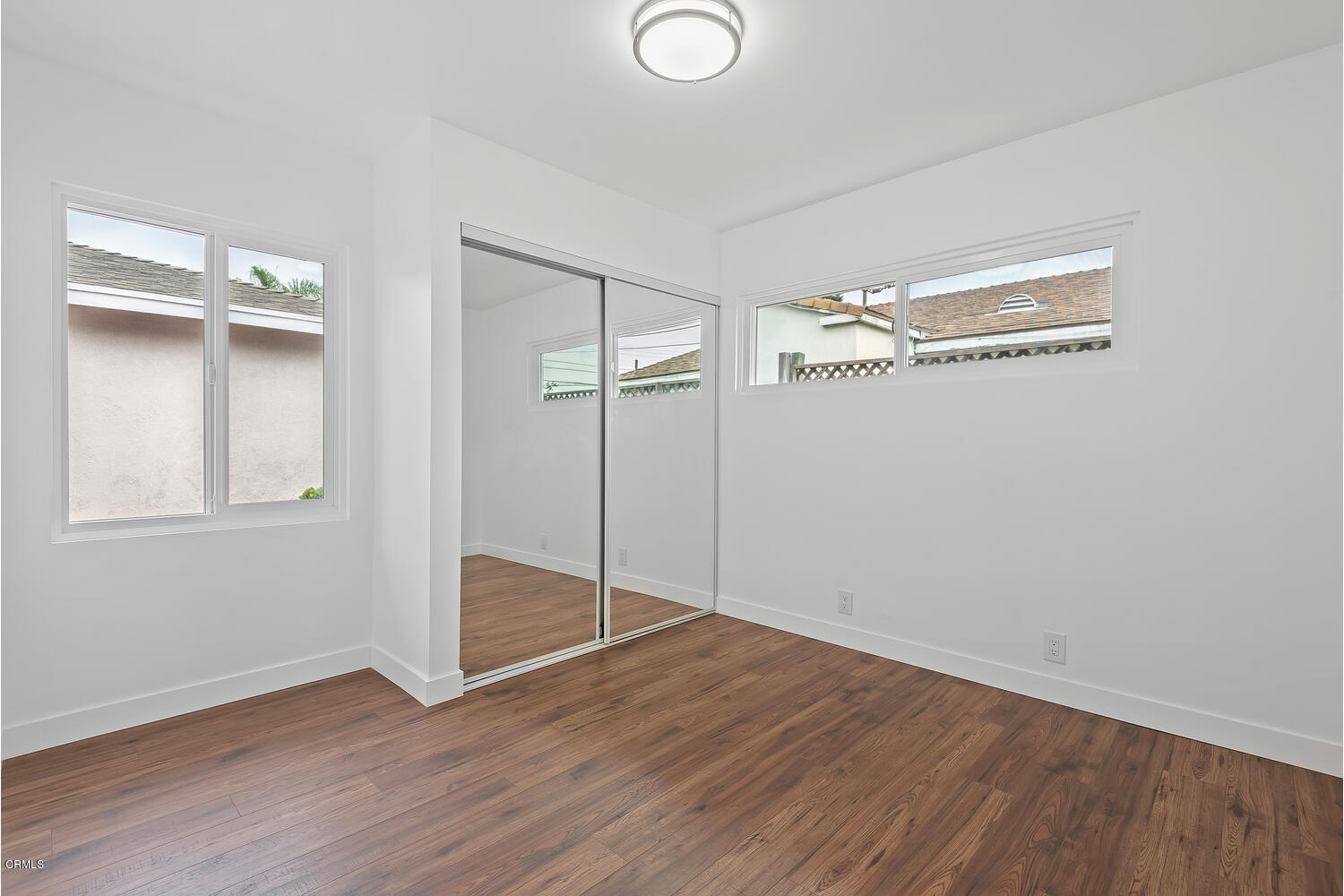 1034 West Roderick Avenue Oxnard, CA 93030 - Photo 16 of 20 a view of an empty room with wooden floor
