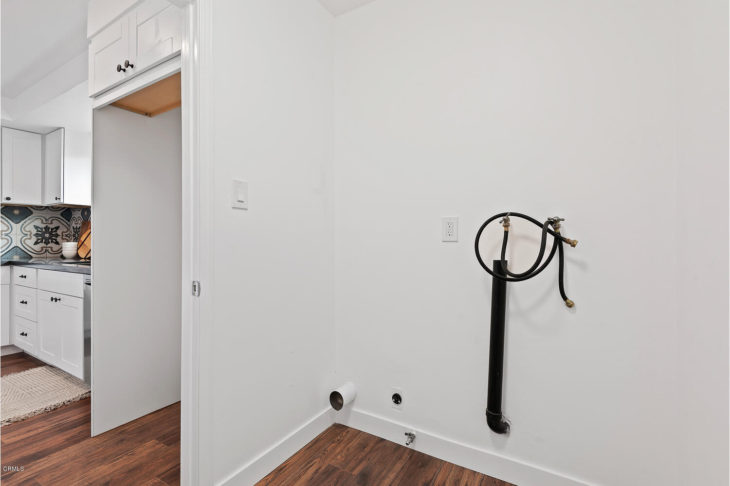 1034 West Roderick Avenue Oxnard, CA 93030 - Photo 18 of 20 a view of a room with rack on the wall