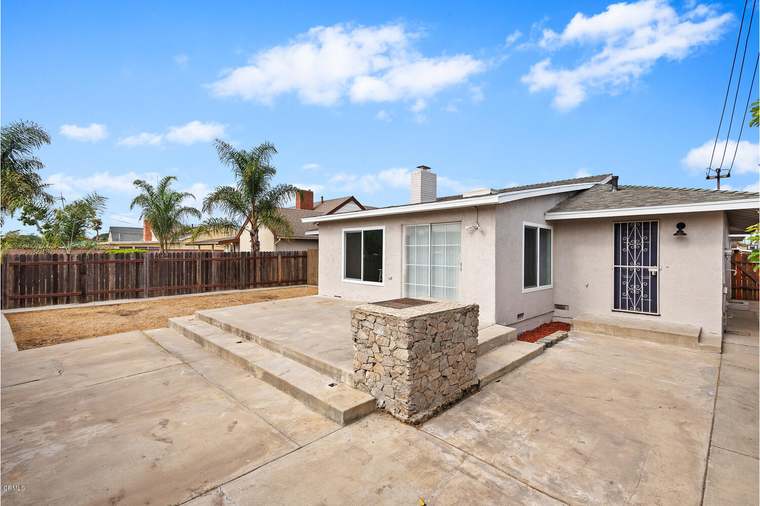 1034 West Roderick Avenue Oxnard, CA 93030 - Photo 20 of 20 a front view of a house with a yard and garage