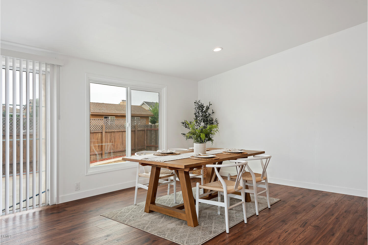1034 West Roderick Avenue Oxnard, CA 93030 - Photo 7 of 20 a dining room with furniture and wooden floor
