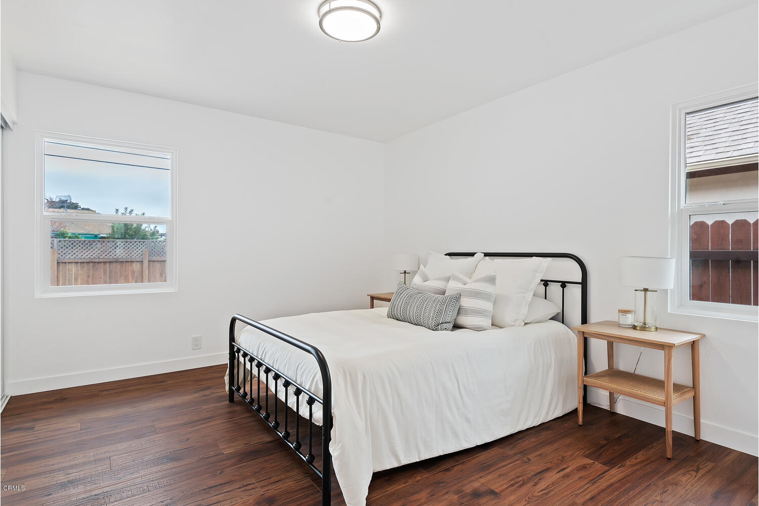 1034 West Roderick Avenue Oxnard, CA 93030 - Photo 10 of 20 a bedroom with a bed and a window