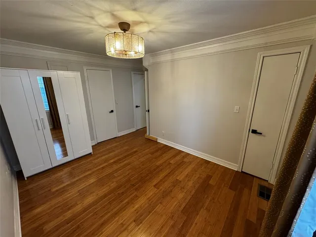 a white toilet sitting next to a small bathroom