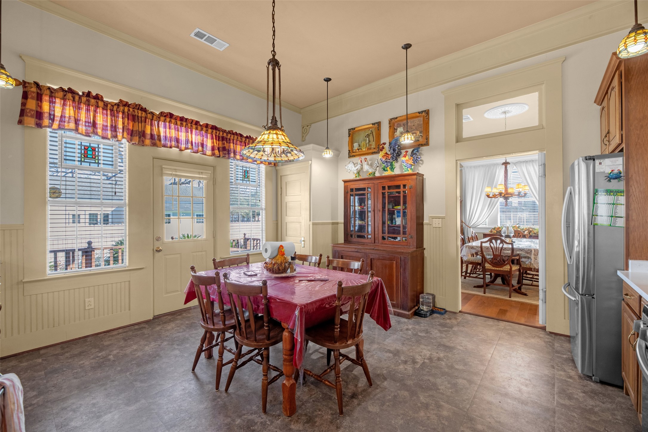 801 North Fulton Street Wharton, TX 77488 - Photo 10 of 43 Here's a view of the kitchen breakfast area looking into the formal dining room. Again, note the high ceilings and beautiful Tiffany lighting.
