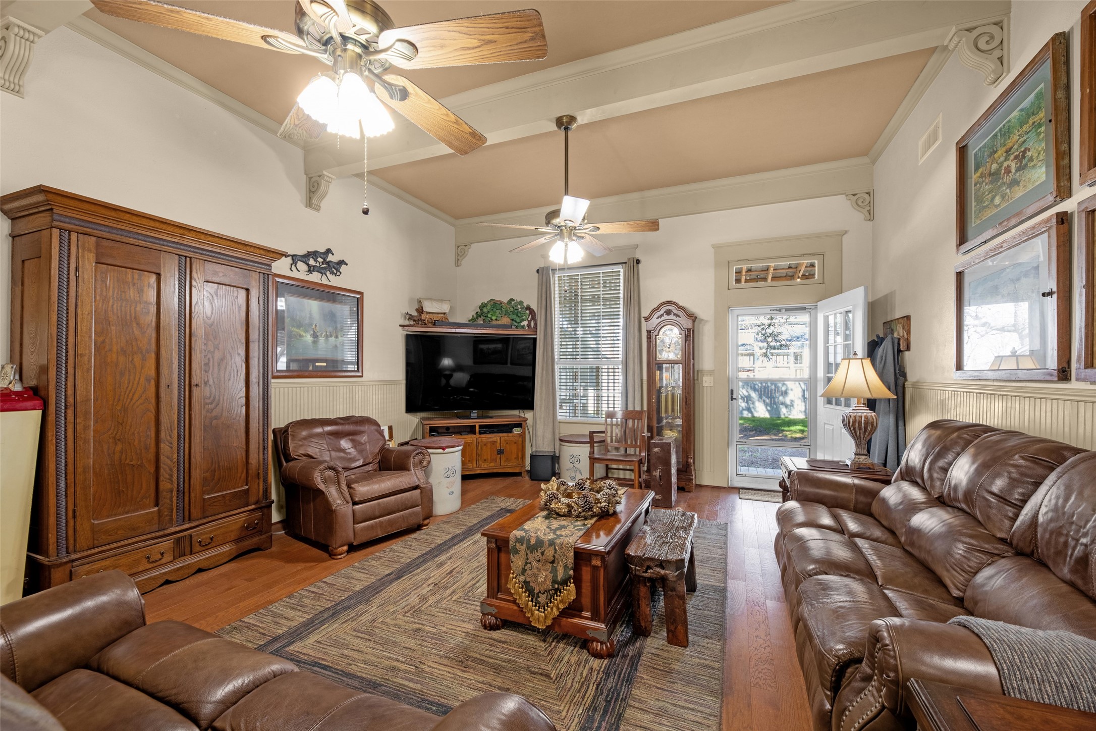 801 North Fulton Street Wharton, TX 77488 - Photo 11 of 43 a living room with furniture a flat screen tv and a fireplace