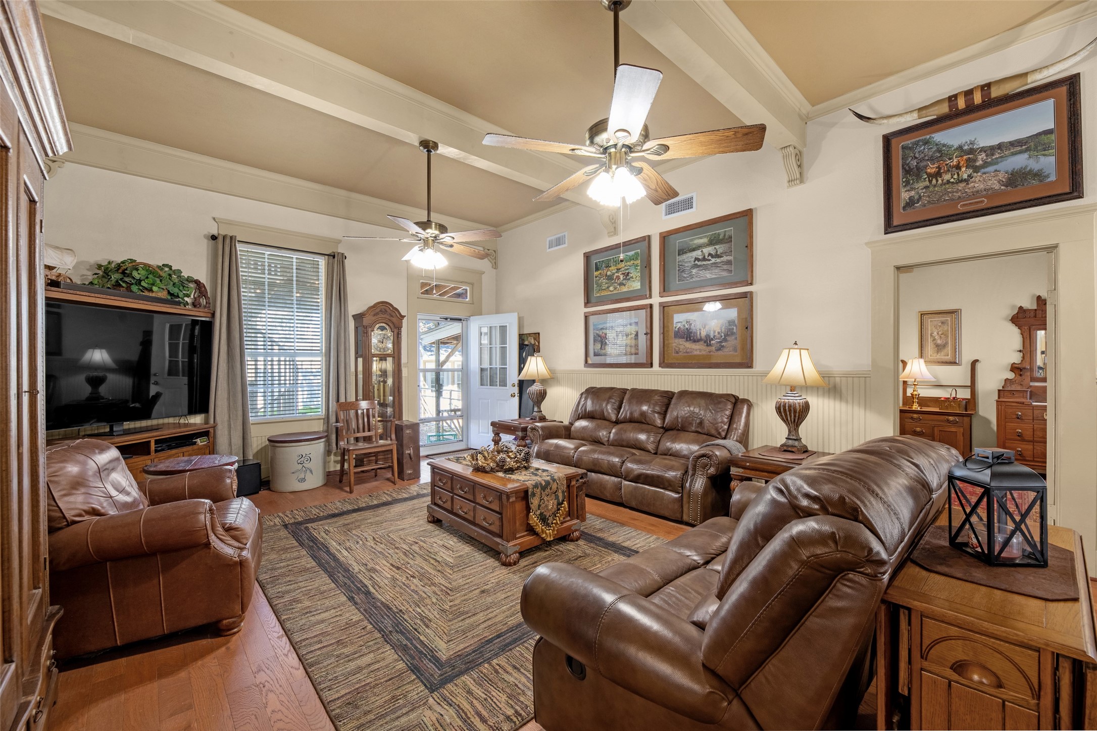 801 North Fulton Street Wharton, TX 77488 - Photo 12 of 43 a living room with furniture a flat screen tv and a window