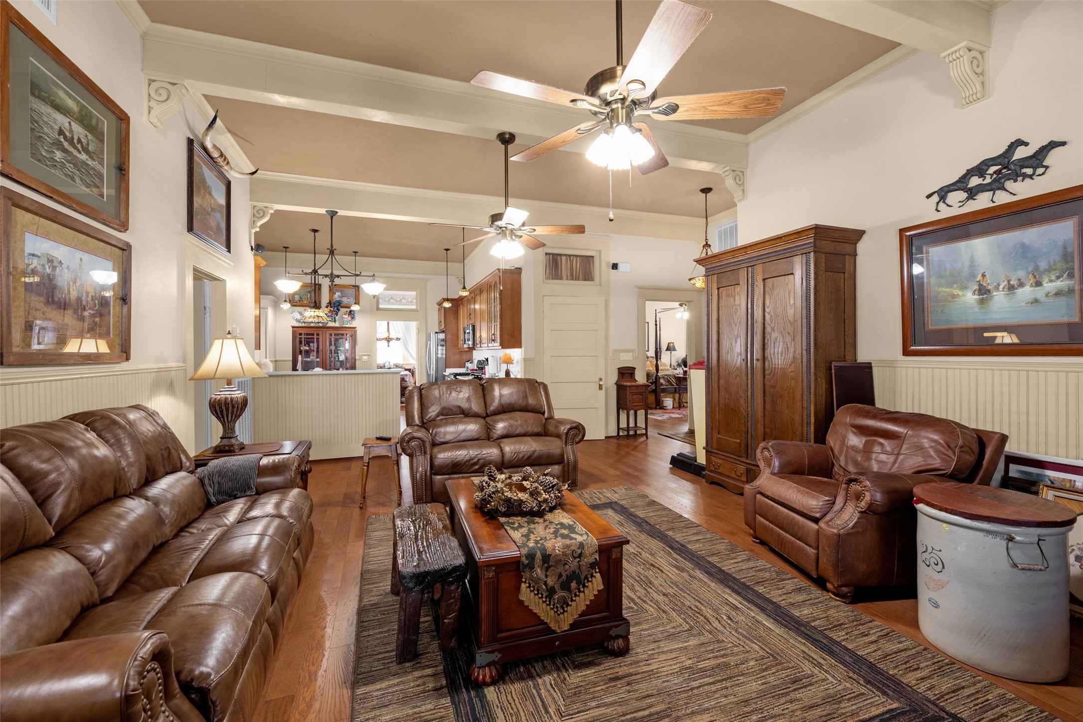 801 North Fulton Street Wharton, TX 77488 - Photo 13 of 43 a living room with furniture kitchen view and a chandelier