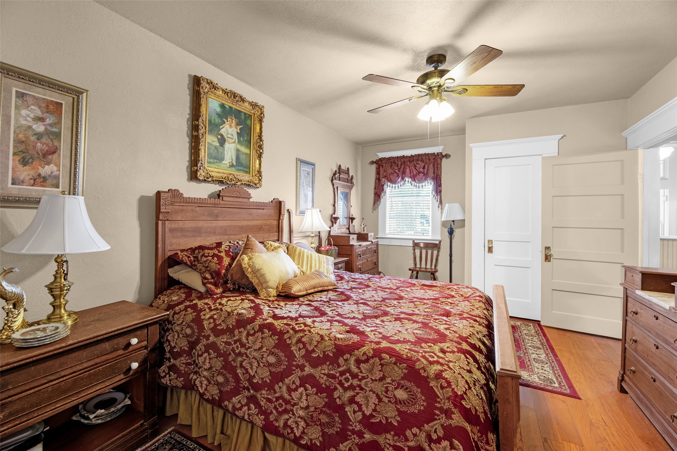 801 North Fulton Street Wharton, TX 77488 - Photo 15 of 43 a bedroom with a bed and wooden floor