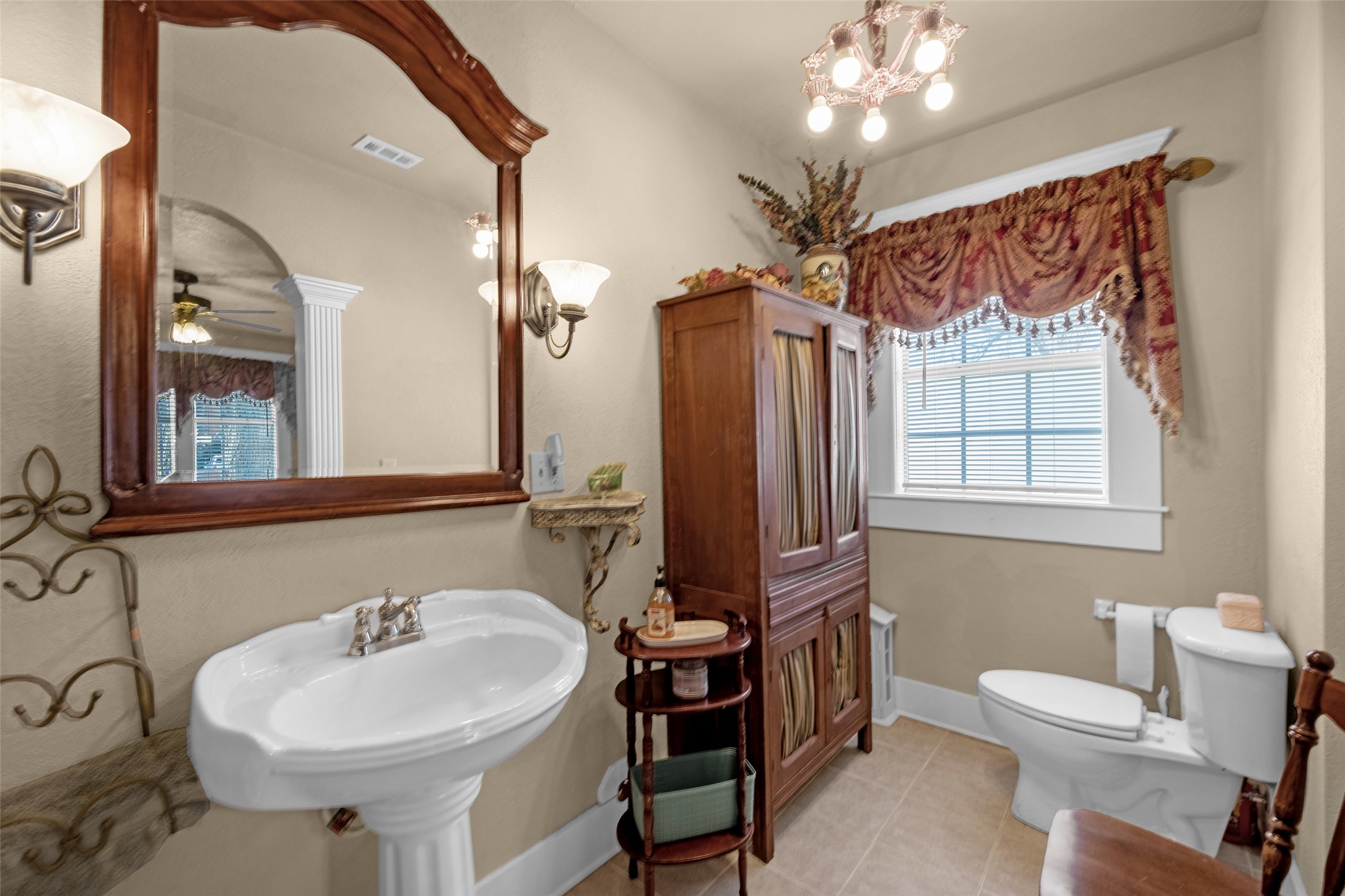 801 North Fulton Street Wharton, TX 77488 - Photo 17 of 43 a bathroom with a sink toilet and mirror