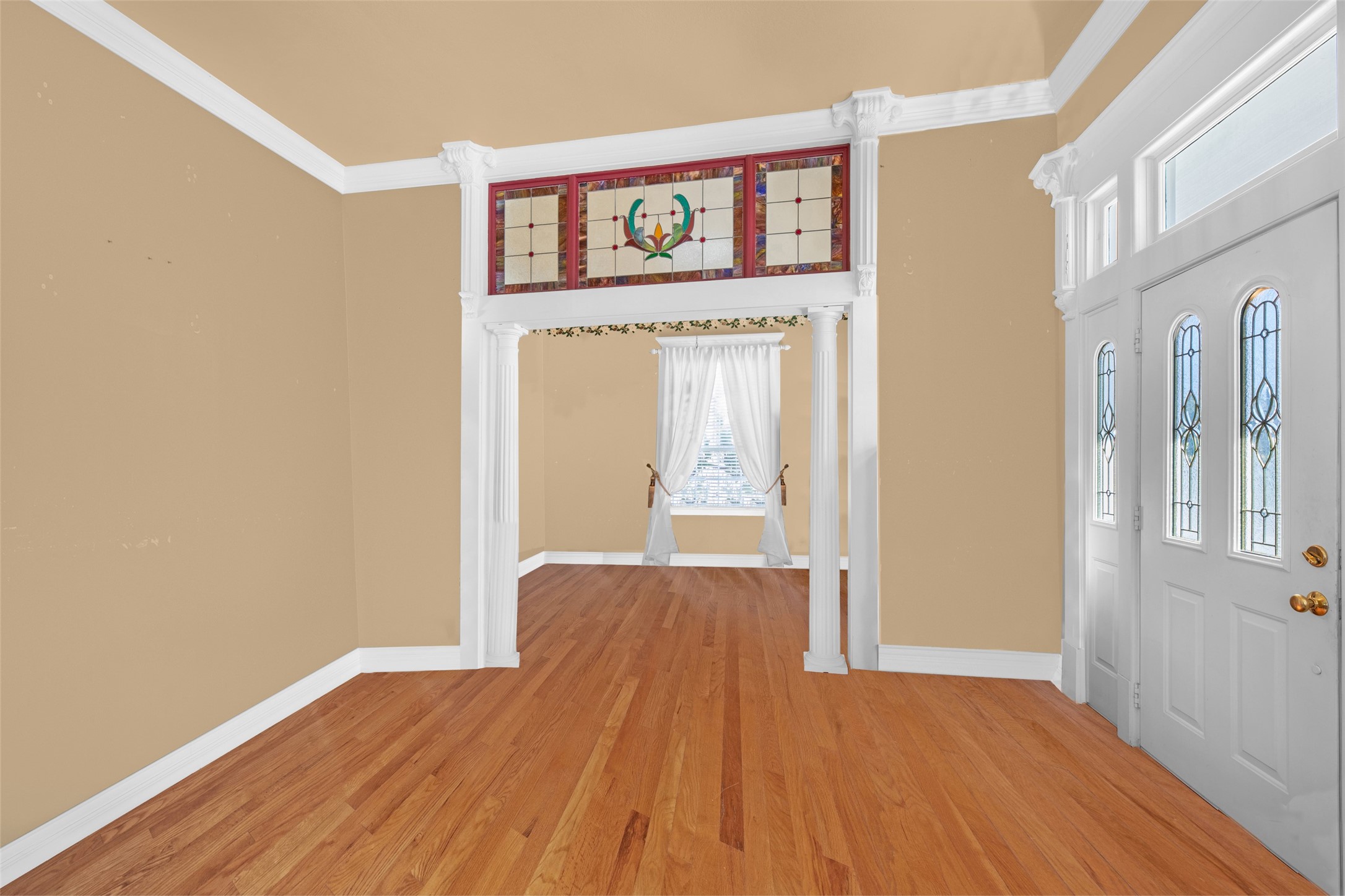 801 North Fulton Street Wharton, TX 77488 - Photo 5 of 43 This beautiful stained glass transom sits between the formal living room and formal dining room. This photo has been digitally edited to remove existing furnishings.