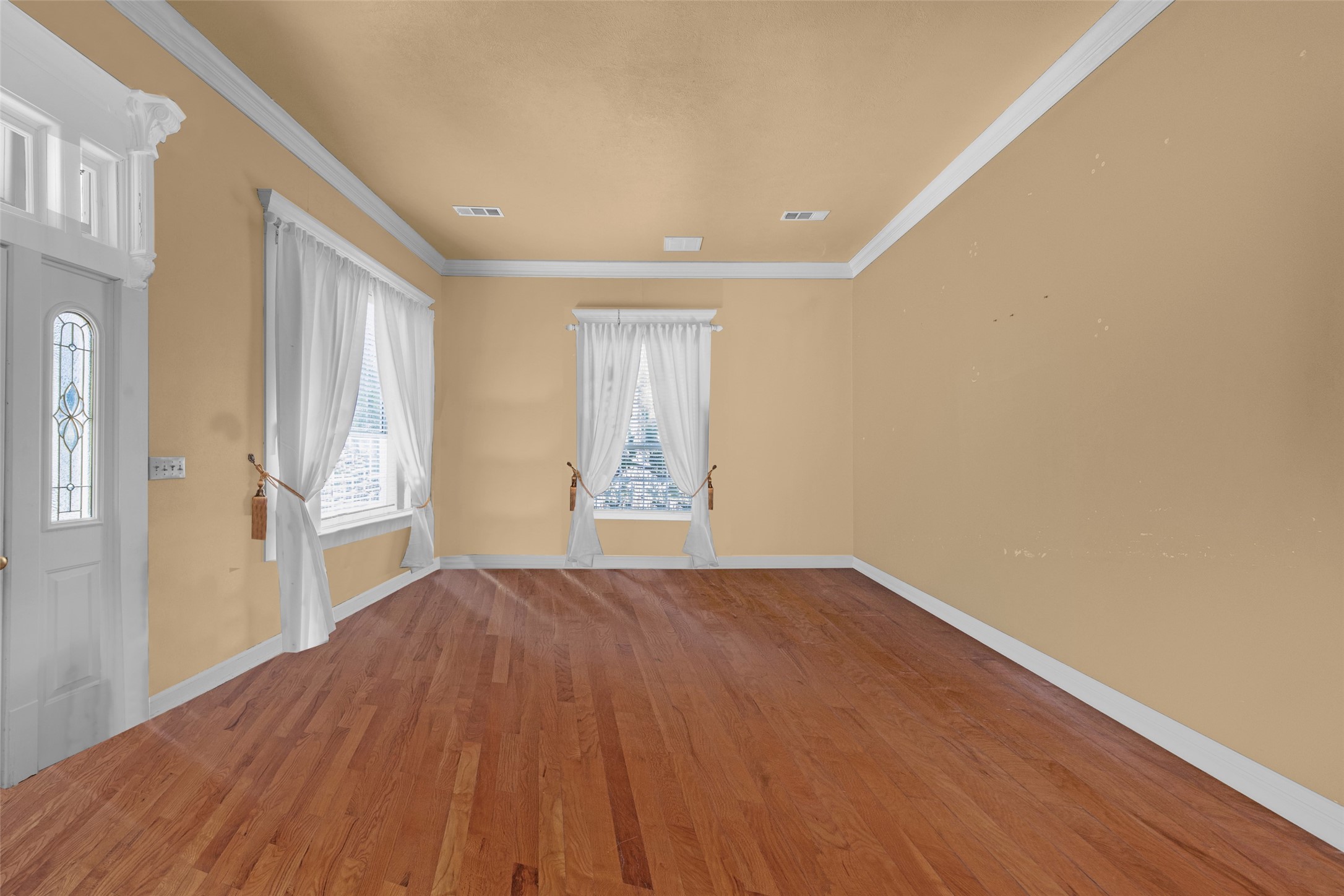801 North Fulton Street Wharton, TX 77488 - Photo 6 of 43 a view of an empty room with wooden floor and a window