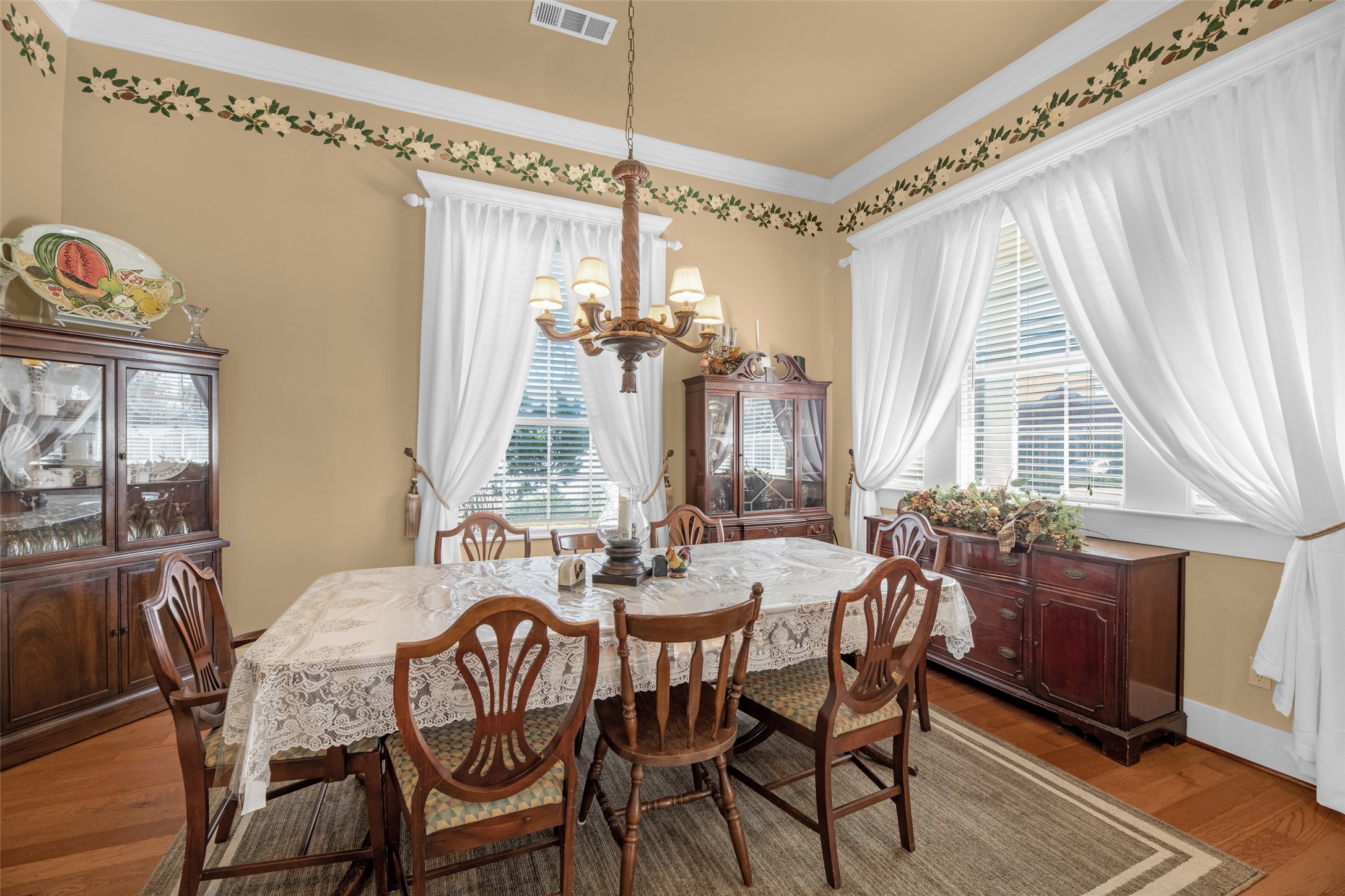 801 North Fulton Street Wharton, TX 77488 - Photo 8 of 43 a view of a dining room with furniture large windows and wooden floor